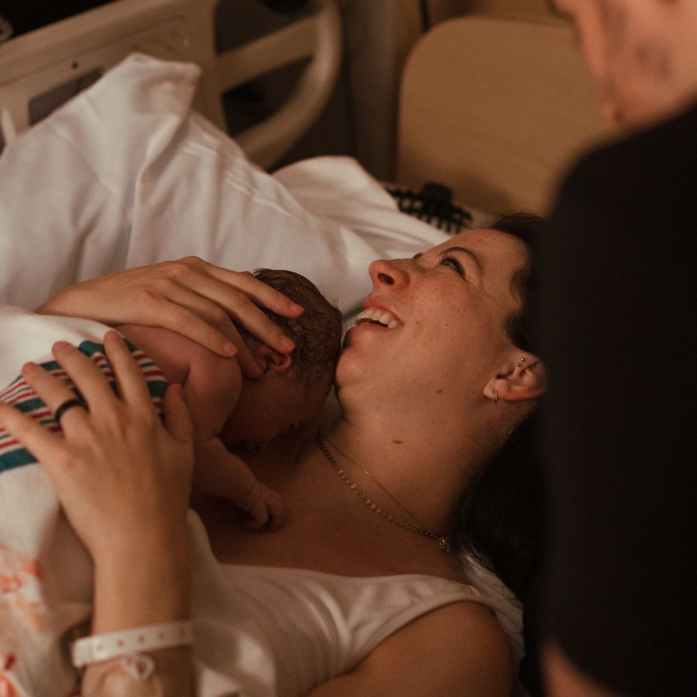 woman holding newborn baby